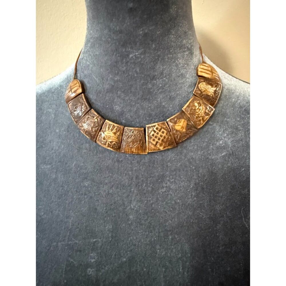 Tibetan handcrafted yak bone necklace carved with the eight auspicious symbols